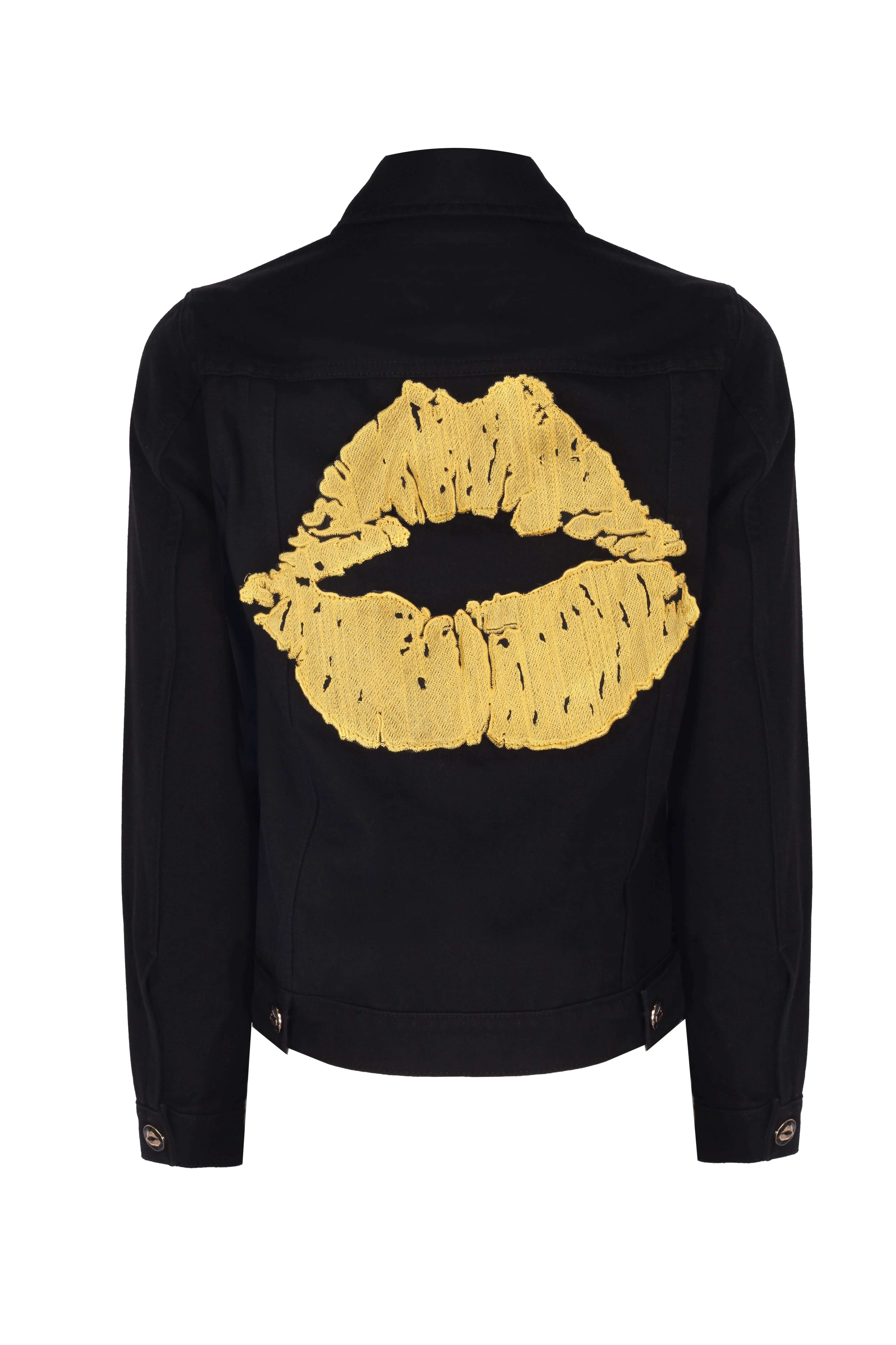 JANE JACKET featuring a black denim fabric with a bold yellow lip print on the back, made from sustainable materials.