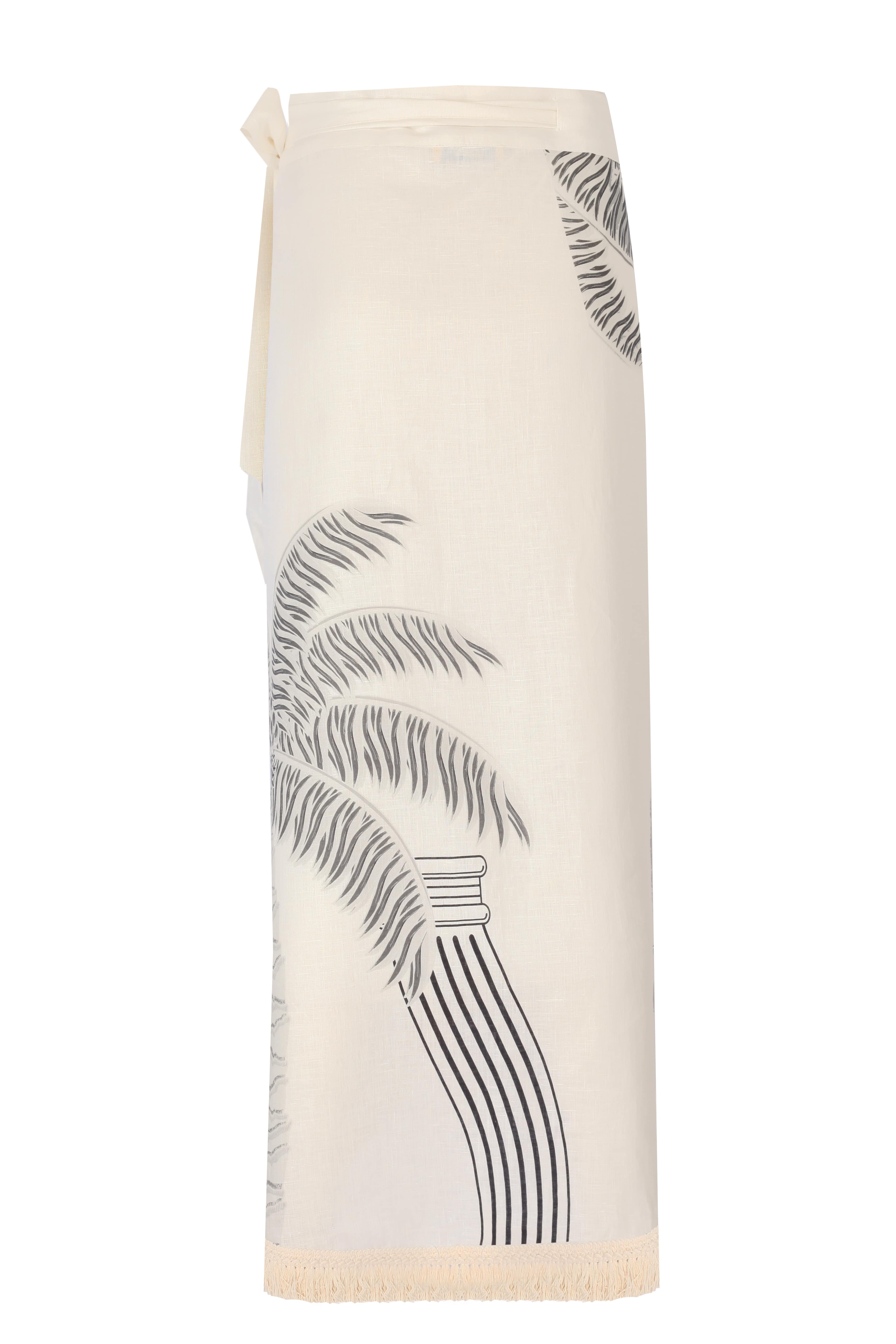 VELDA PAREO in cream linen featuring palm leaf design, perfect for beach outings. Dry clean only for best care.